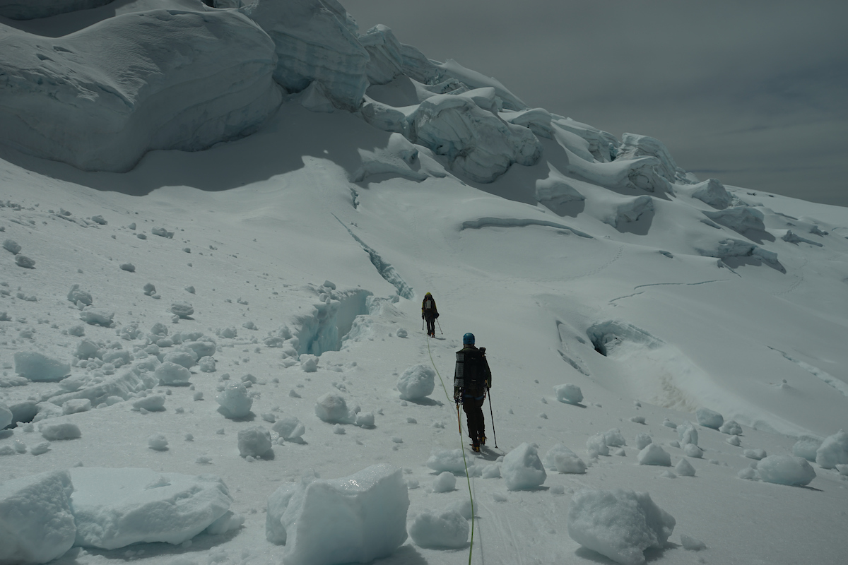 Mountaineering-in-Ecuador-image-two-climbers-safely-crossing-crevasses.jpg